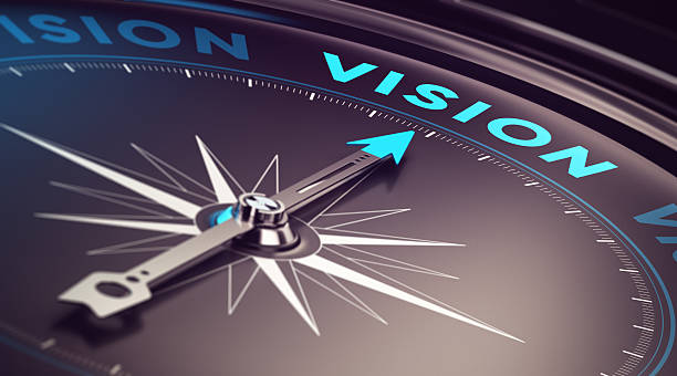 Compass needle pointing toward the word "VISION" to represent guidance, purpose, and forward-thinking leadership.